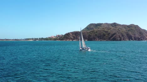 sailboat sailing in a pacific bay in mexico