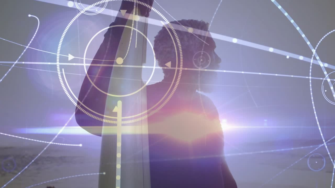 Sun glare initiating data visualization orbiting wetsuit-wearing man holding surfboard on beach