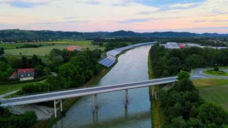 captivating aerial 4k drone footage of a solar panel plant nestled alongside the drava river in slovenia