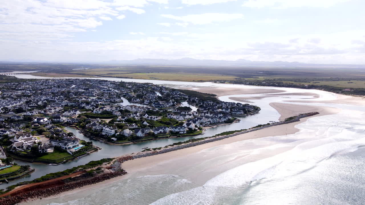 St Francis Bay on Kromme River mouth with protective breakwater groyne, aerial
