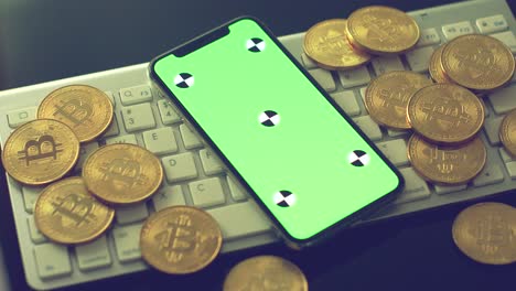 Mobile-phone-with-gold-bitcoins