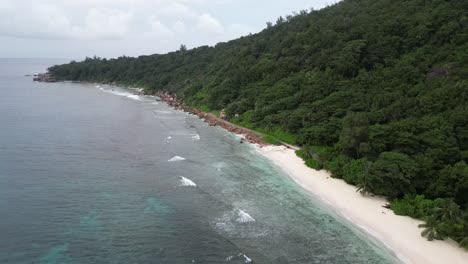 tropical seclude white sand beach untouched mother earth in la digue island, seychelles archipelago indian ocean