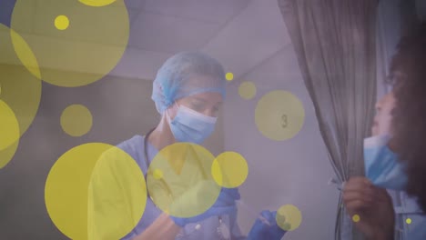 Animation-of-yellow-spots-over-caucasian-female-doctor-in-face-mask-with-swab-and-female-patient