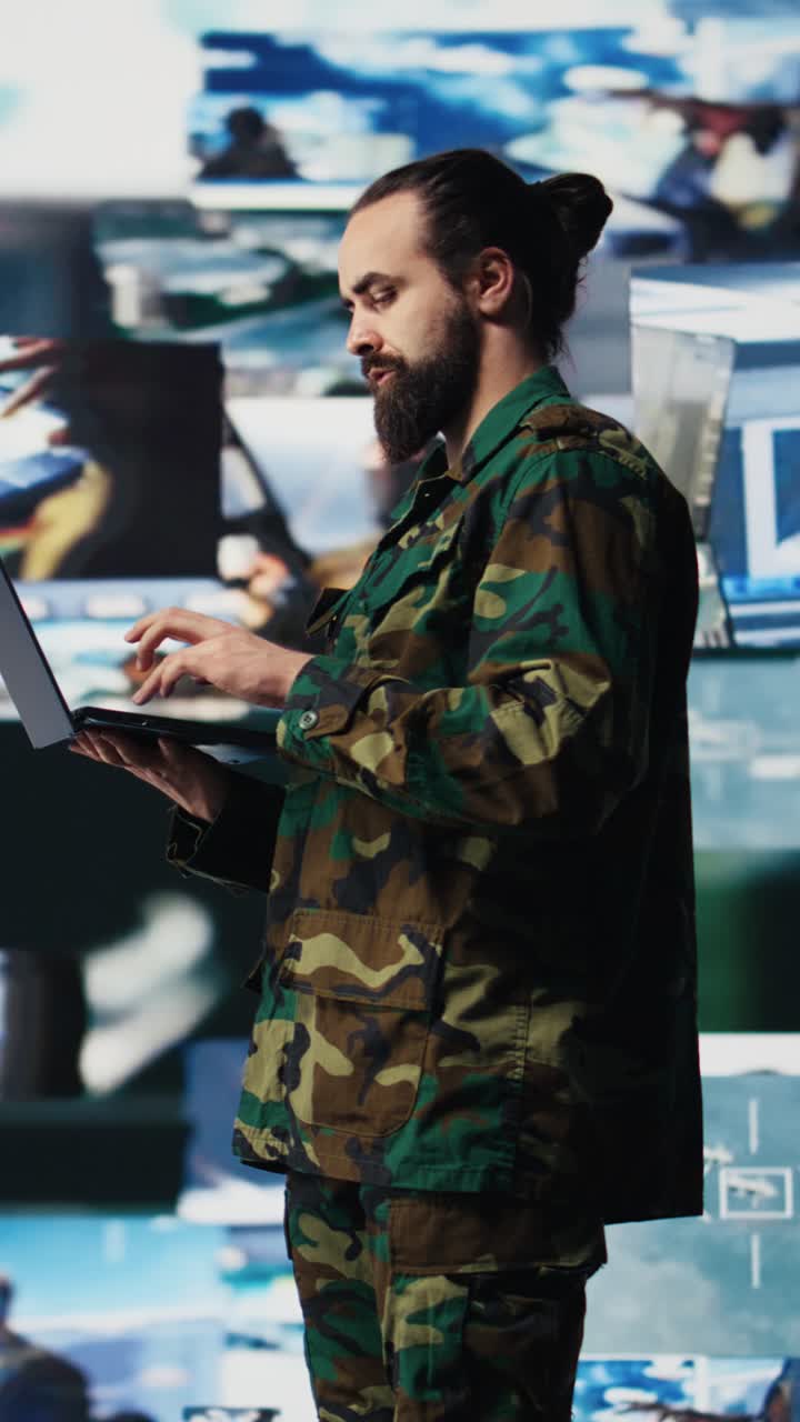 Vertical Video Officer monitoring real time combat data using advanced military systems