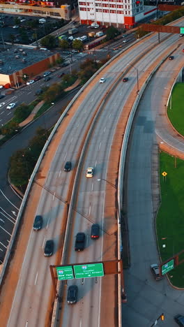 flying above the highways with lively traffic. philadelphia roads from aerial perspective. vertical video