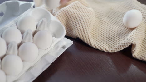 Eggs-in-carton-box-on-kitchen-table.-Closeup.-Ingredients-for-cake-baking