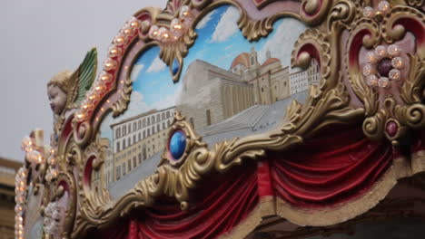 ornate vintage carousel with cityscape paintings