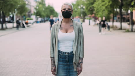 woman wearing mask in city street