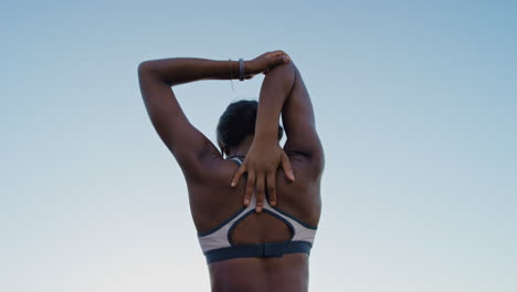 fitness, health and back of black woman stretching