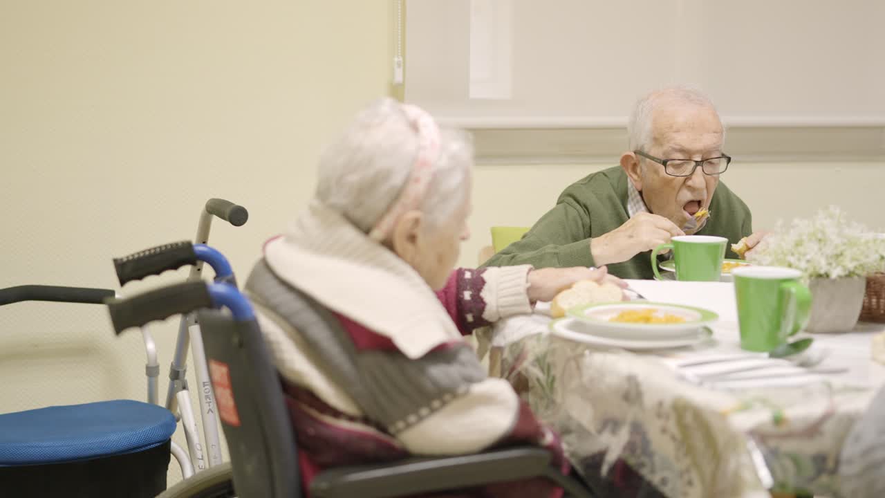 Senior people eating in a dinning room in a geriatric