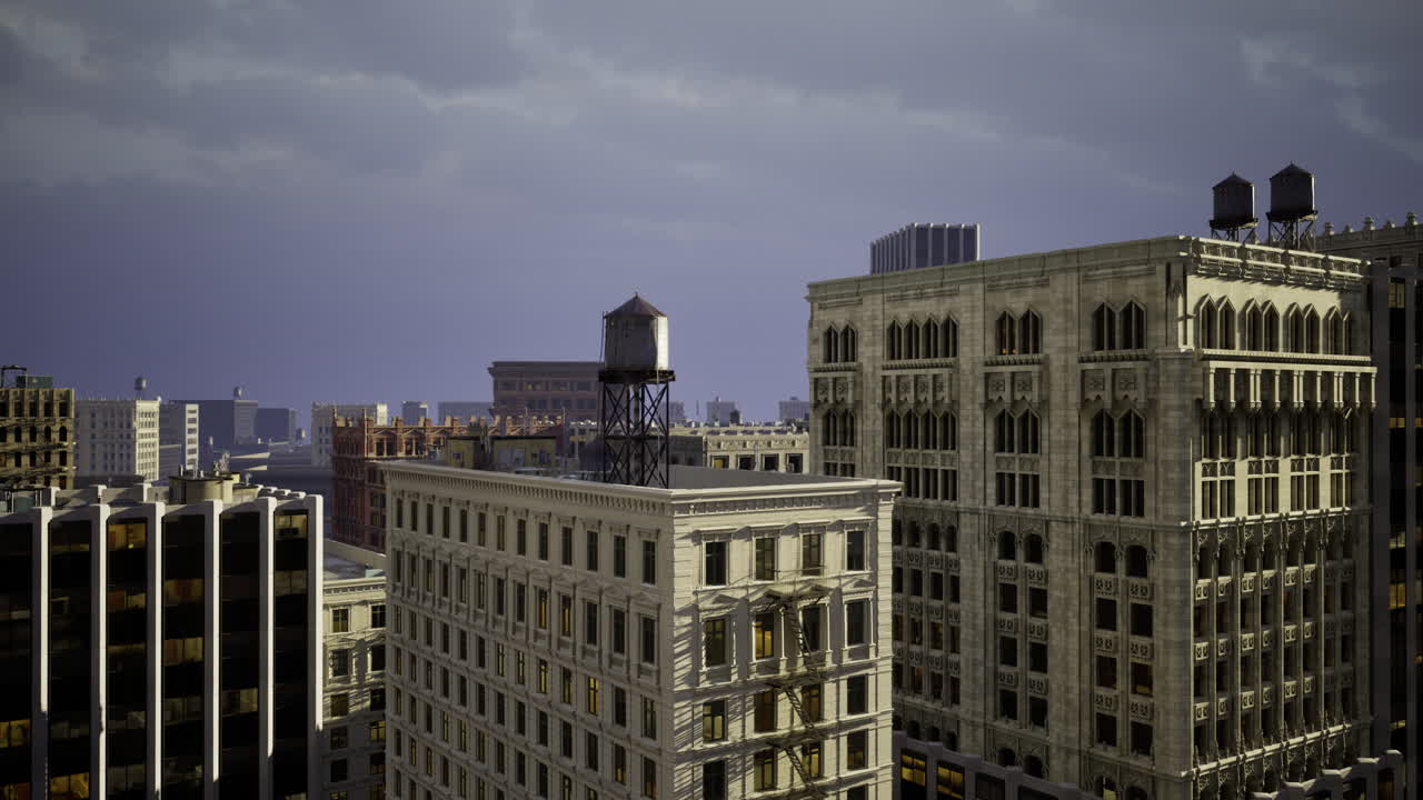 View of urban skyline at twilight with vintage water tower atop building