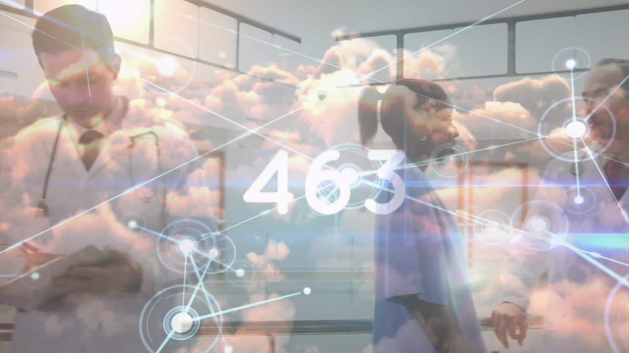 un grupo de trabajadores de la salud están reunidos en un pasillo del hospital, con un médico sosteniendo un clipboard.