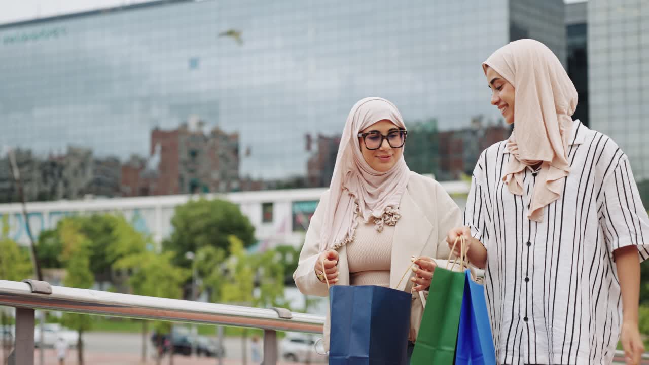 Two Stylish Women in Hijabs Shopping in the City