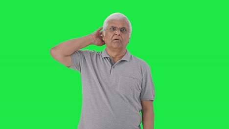 Tensed-Indian-old-man-sees-something-shocking-Green-screen