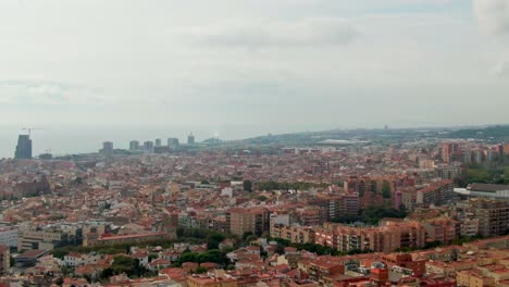 wide vast aerial showing small city of rocafonda in spain at high angle. ocean view.