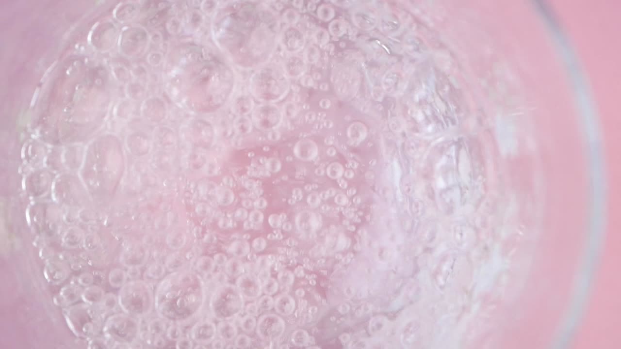 Pouring Sparkling Water into a Glass