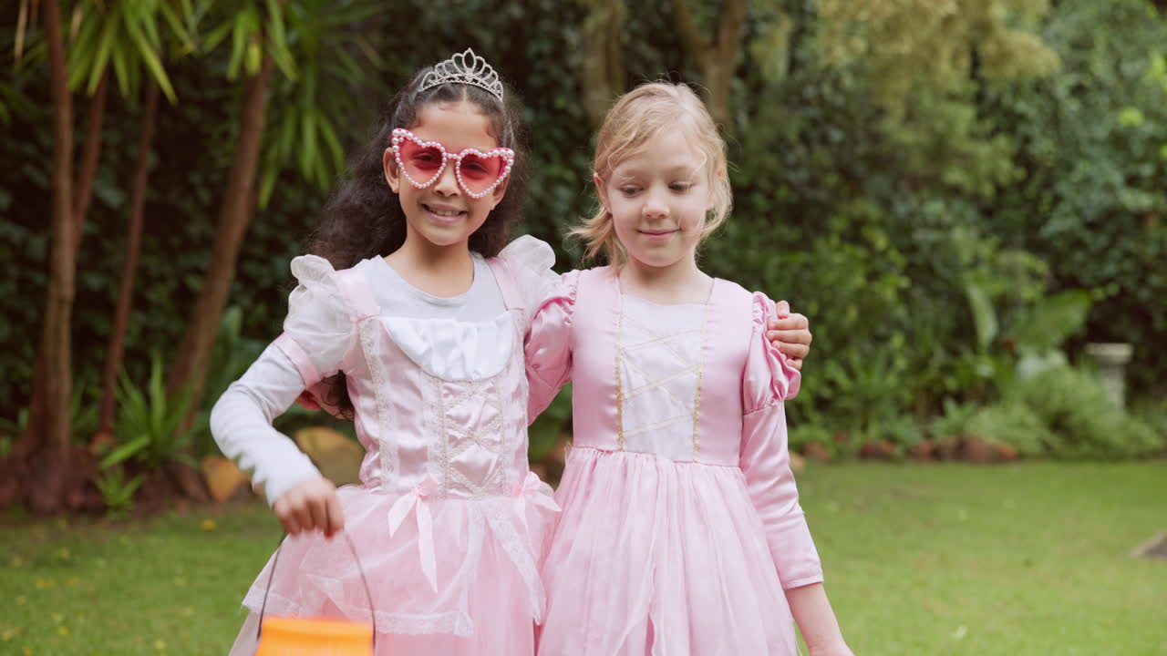 Two Girls in Princess Costumes Holding Halloween Buckets