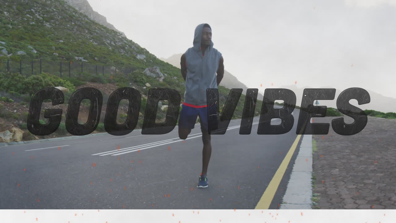 Animation of the words good vibes only in black over man exercising on mountain road