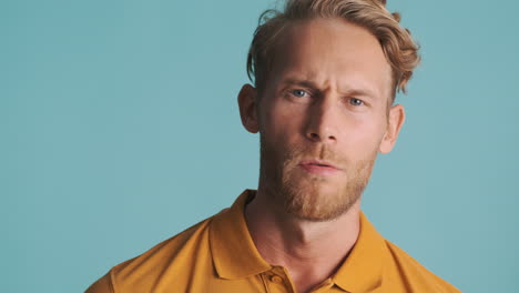 Shocked-man-in-yellow-polo-T-shirt