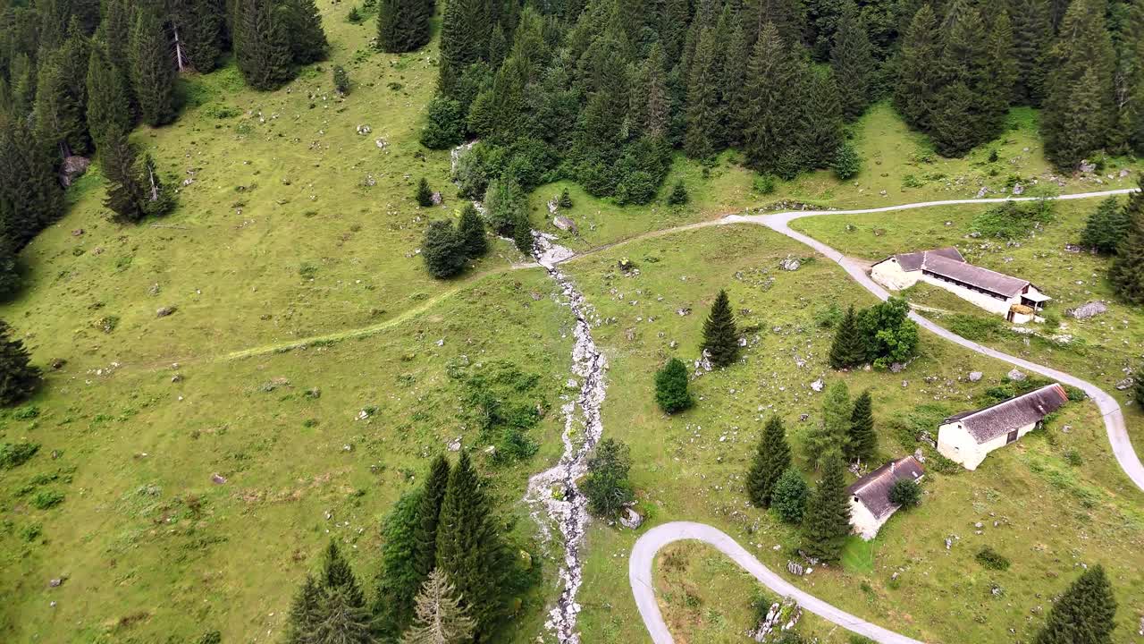 Aerial View of Alpine Farm and Winding Road