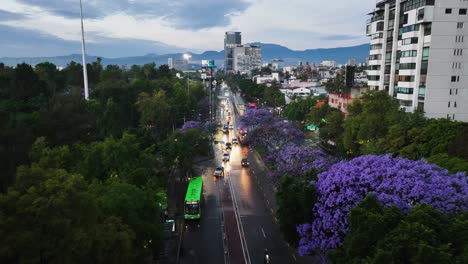 aerial view of the police driving on the streets of cdmx, spring evening in mexico city