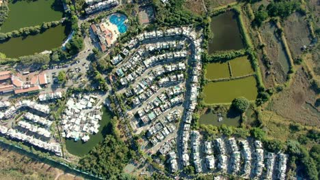 aerial pass above middle class suburban neighbourhood houses