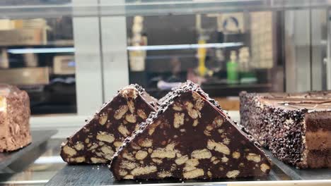chocolate cakes and pastries in a display case