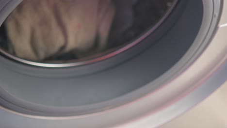 loading laundry into washing machine