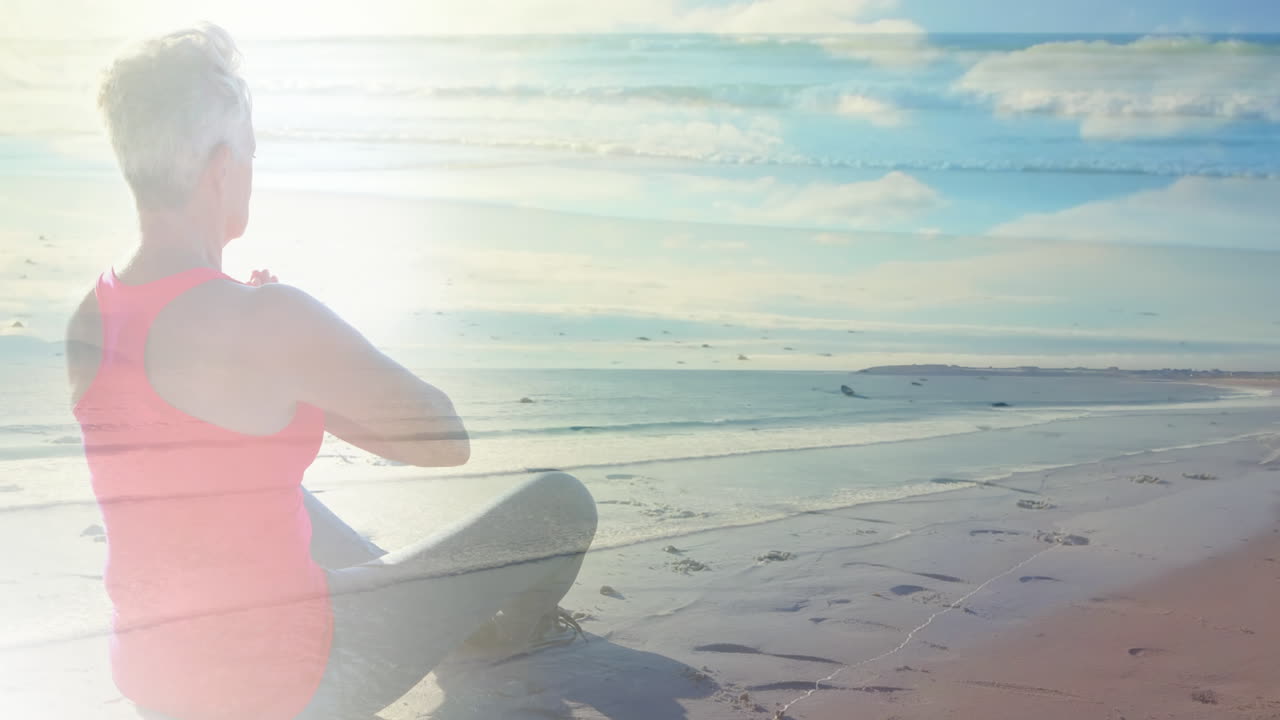 바 ⁇ 가에서 요가를 연습하는 고령 여성 위에 반 ⁇ 이는 빛의 애니메이션