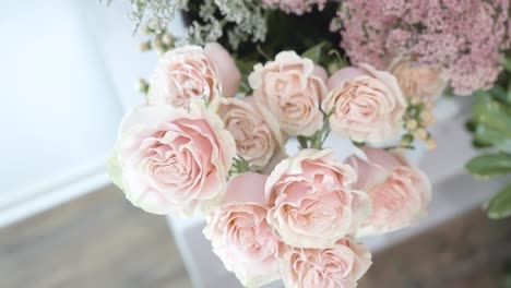 Pulling-away-from-a-bouquet-of-lovely-pink-roses