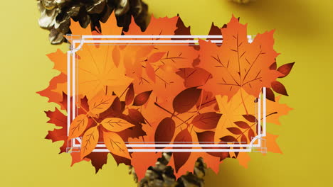 animation of white frame and autumn leaves over pine cones on yellow background