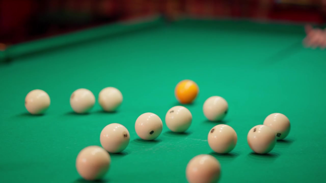 Slow Motion Shot of Billiard Balls Breaking on a Green Pool Table