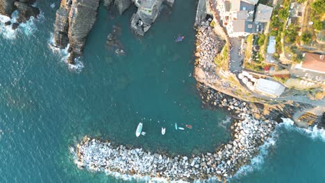 top down drone shot of cinque terre town at sunset in italy