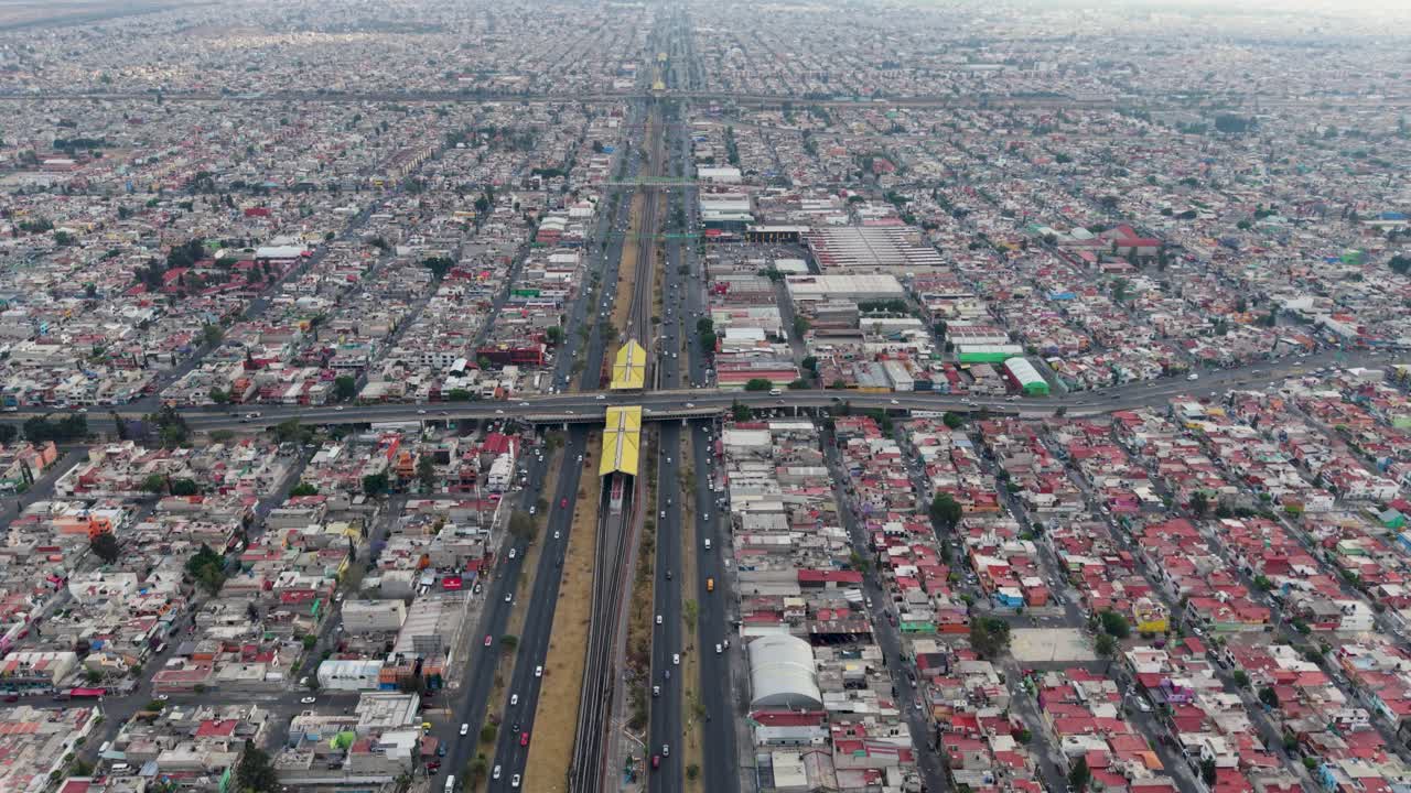 Drone cinematography of Ecatepec's grand avenues and densely populated urban landscape