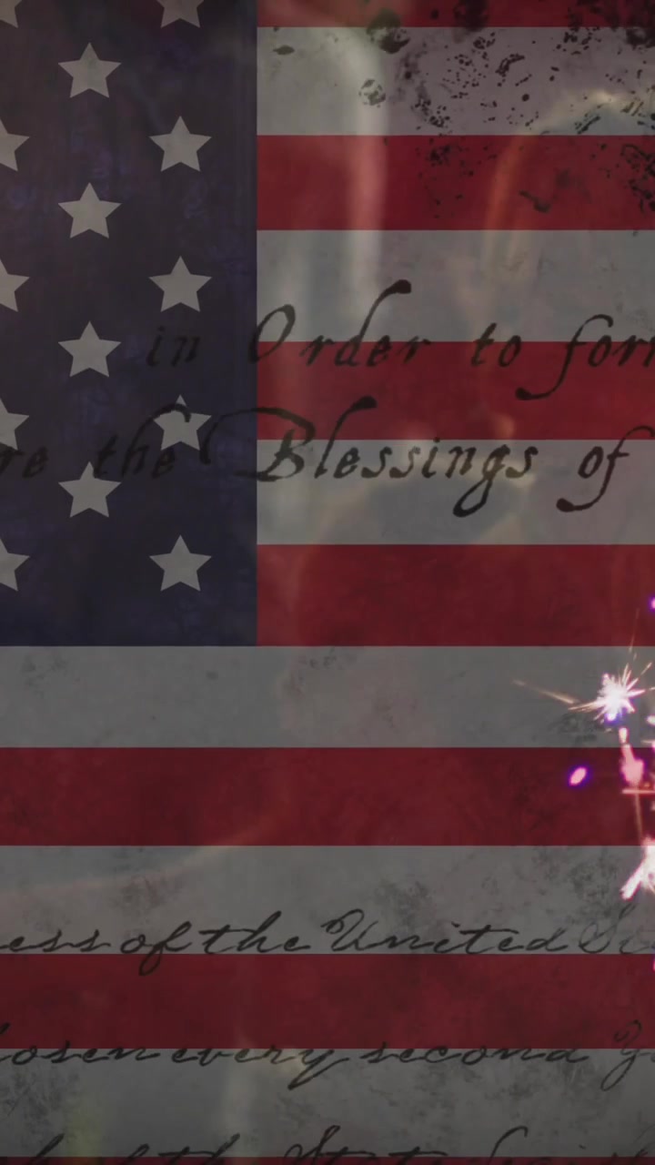 Animation of american flag over diverse group of friends celebrating with sparklers