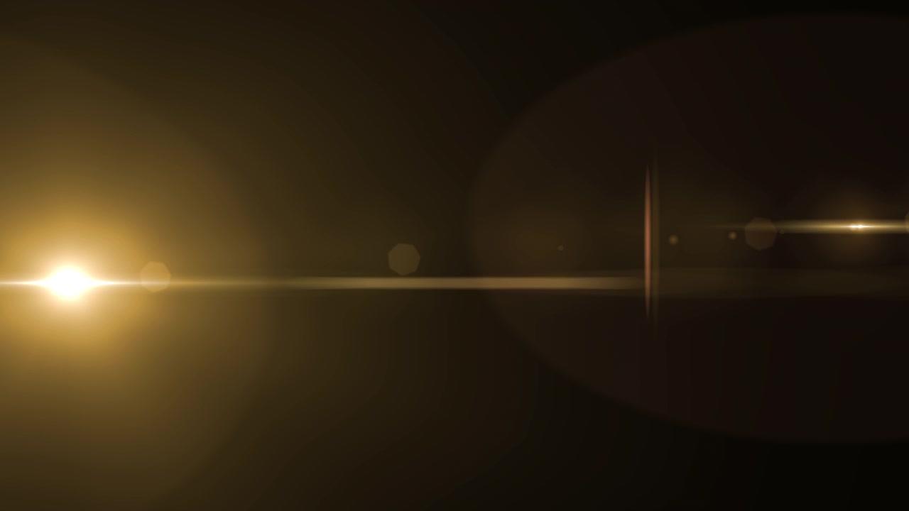 Golden Lens Flare Overlay on Black Background