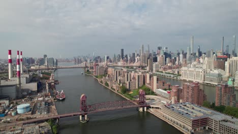 long smooth aerial panorama of nyc skyline from the east river