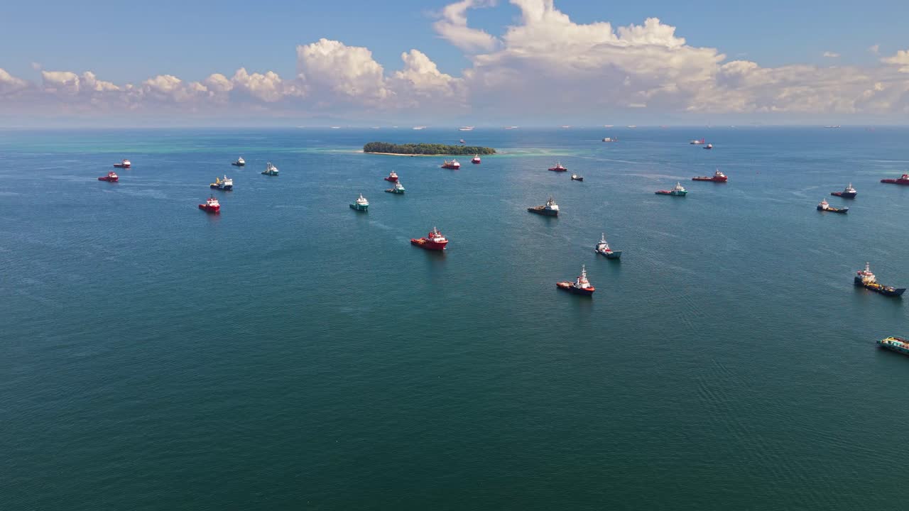 Aerial shot of offshore supply vessel ships in front of Labuan Island, Malaysia