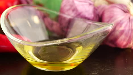 close-up of olive oil and purple garlic