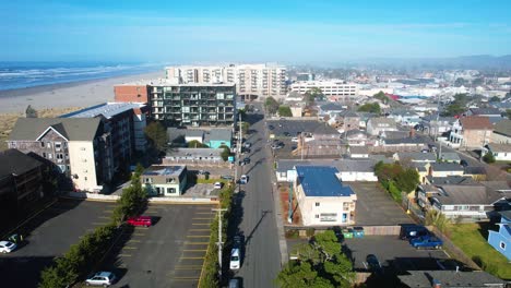 4k aerial drone shot quickly flying over houses at seaside, oregon