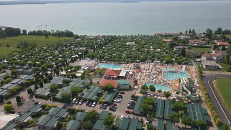 aerial view of swimming pool and lake garda at camping lido lazise in italy