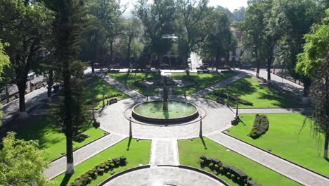 drone shot over trees of patzcuaro main plaza