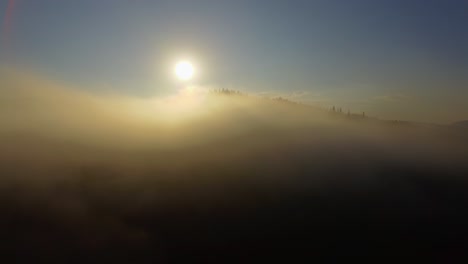 aerial view. flying over the beautiful mountain in clouds. aerial camera shot. sunrise 01