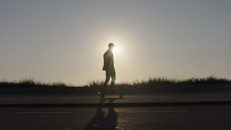 skateboarding on sidewalk down road past people, silhouette at sunset, tracking