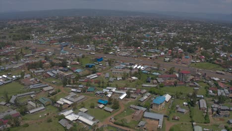 drone shot of nyamasaria settlement in kisumu showing many houses and a busy highway