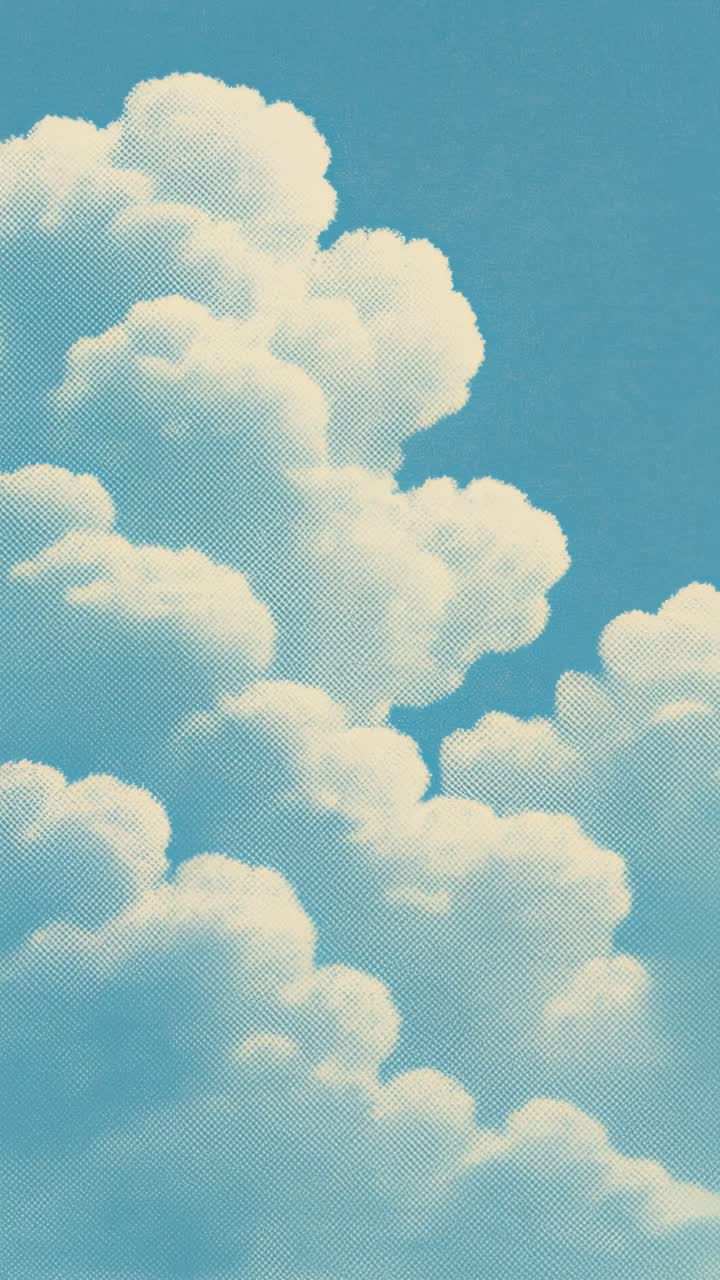 Vintage-style video still of fluffy clouds from a low angle against a clear blue sky