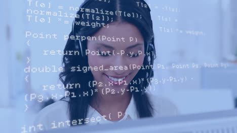 Woman wearing a headset while using a computer