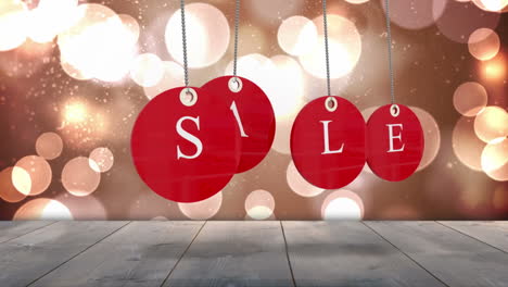 Red-sale-tags-hanging-against-glowing-background