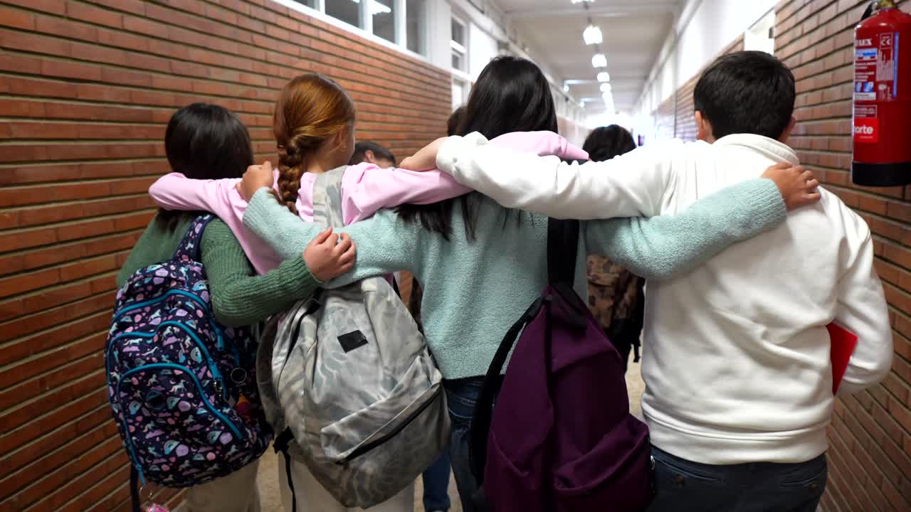 Group of Students Walking in School Hallway