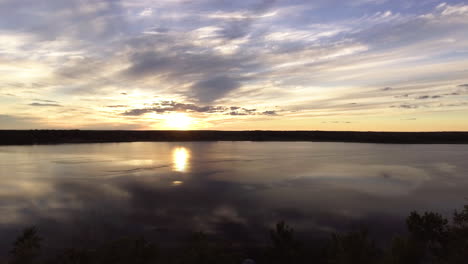 aerial over beautiful lake at sunset